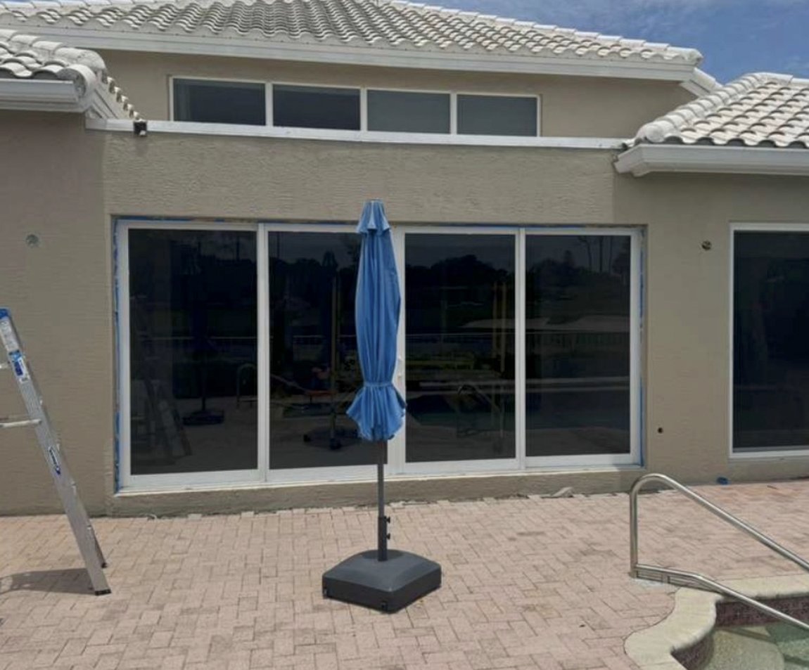 Impact-glass patio enclosure